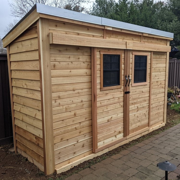 Outdoor Living Today GardenSaver 12x4 shed showing its wooden sliding doors from the main front view.