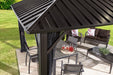 Corner view of Sojag Genova Gazebo roof with outdoor furniture underneath