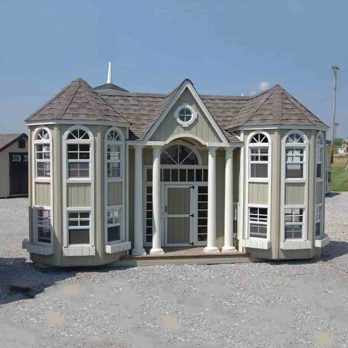 The Grand Portico Mansion playhouse by Little Cottage Company showcasing its elegant design with multiple windows and a central doorway.