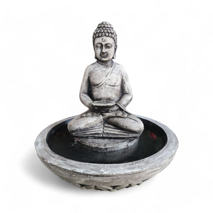 Gray-tone Exaco Buddha Fountain water feature with serene statue seated cross-legged in a bowl, isolated on a white background.