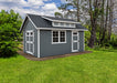 Ez-Fit Kits Skyview Shed Kit in a landscaped backyard with double doors, single door, picture window, shed dormer, and blue cloudy sky