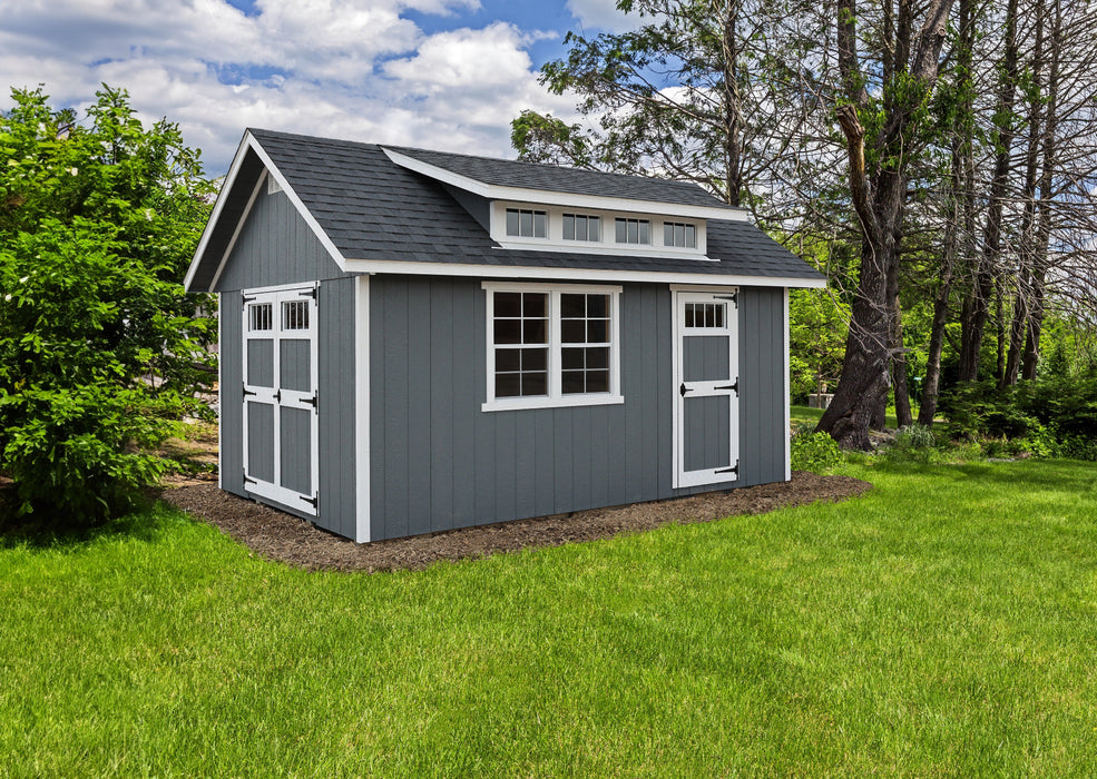 Ez-Fit Kits Skyview Shed Kit in a landscaped backyard with double doors, single door, picture window, shed dormer, and blue cloudy sky