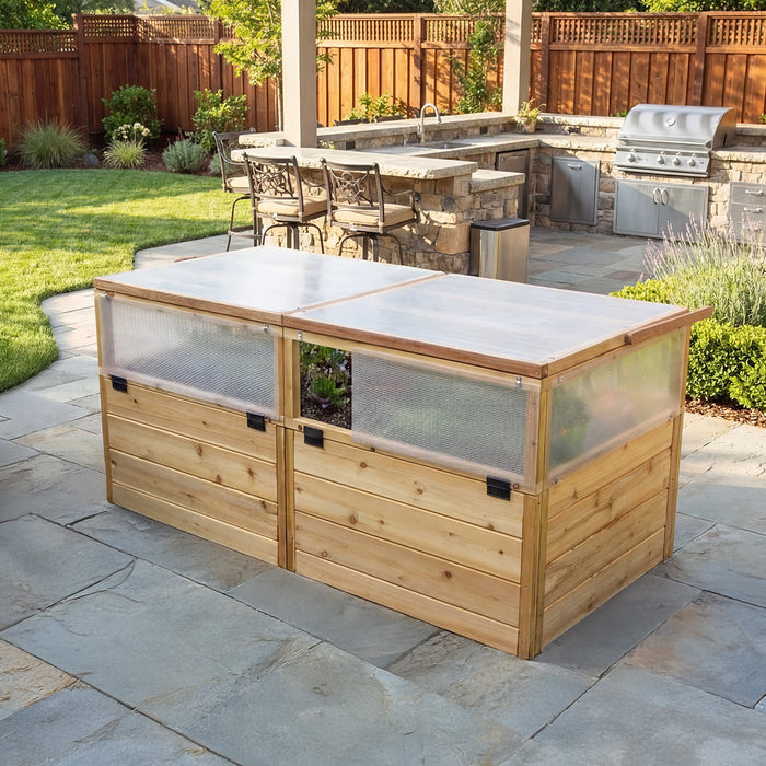 Angled view of the 6x3 Outdoor Living Today Greenhouse with Garden in a Box on flagstone, showing vented side panels and cedar plank walls