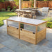 Angled view of the 6x3 Outdoor Living Today Greenhouse with Garden in a Box on flagstone, showing vented side panels and cedar plank walls