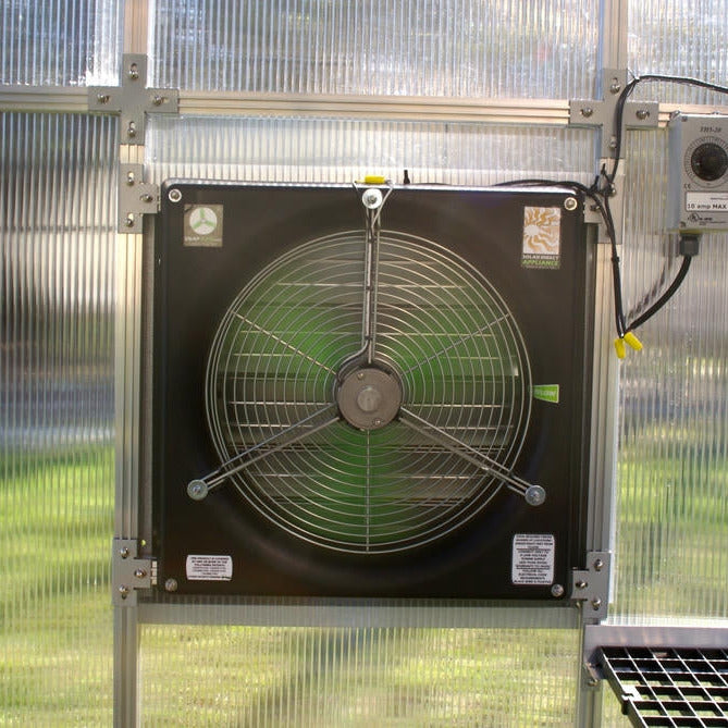 Riverstone MONT Solar Powered Ventilation System fan mounted inside greenhouse with thermostat control and aluminum frame.