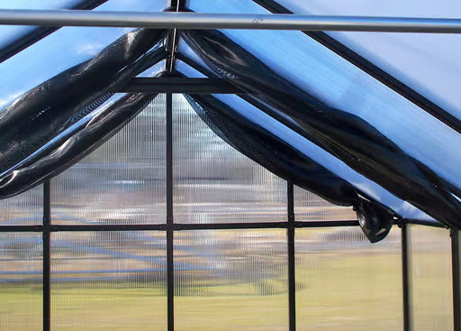 Interior view of Riverstone Greenhouse Internal Shade Cloth system attached to frame for sun protection