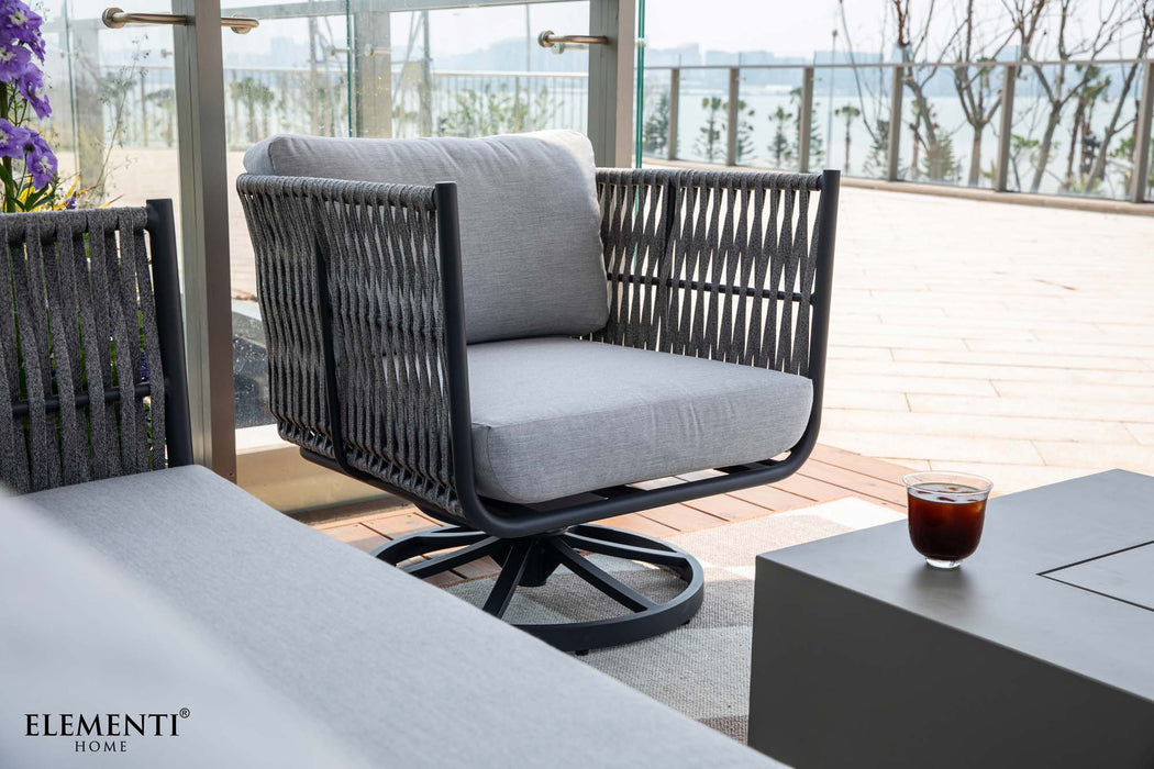 Close-up of a grey rope weave swivel armchair with light cushions from the Elementi Milano Collection. 
