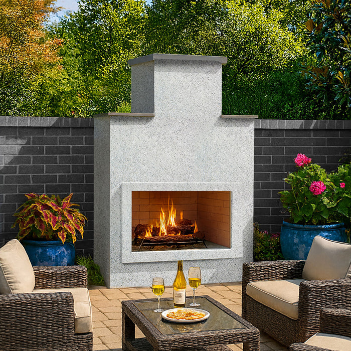 Cal Flame Escape Fireplace Indio model in an outdoor seating area with a burning fire and ameristone stucco finish.