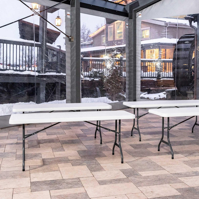 Lifetime 4 Pack 6-Foot Rectangle Folding Tables set up indoors with outdoor winter view through windows