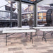 Lifetime 4 Pack 6-Foot Rectangle Folding Tables set up indoors with outdoor winter view through windows