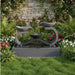 Exaco Infinity Outdoor Water Fountain in Slate, front view with water streaming from both tiers into a stone patio setting.