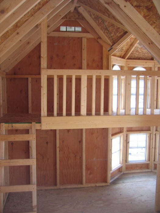 Sunlight filters through the tall windows of the Little Cottage Company's Grand Mansion playhouse interior.