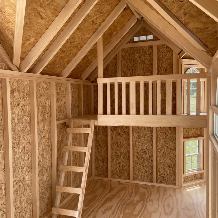 Sunlight filters through the tall windows of the Little Cottage Company's Grand Mansion playhouse interior.