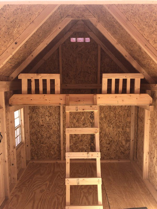 Detailed view of the loft inside the Pennfield Cottage Playhouse by Little Cottage Company, showcasing its cozy and inviting space.