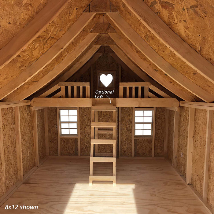 Interior view of the Little Cottage Company Gingerbread Cottage Playhouse featuring a loft with ladder and heart-shaped window.