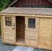 outdoor living today spacesaver 12x4 storage shed with a partially open sliding door that reveals the interior