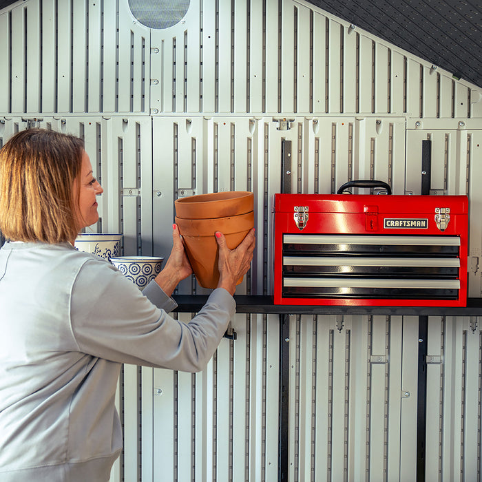  Inside view of the Lifetime Shed Classic 10 x 8 showing mounted storage and a red toolbox on the wall.