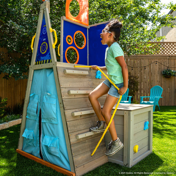 Kid climbing on the wooden playset