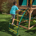 Kid climbing up on the outdoor playset