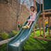 Kid sliding on the wooden swing set