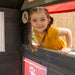 kid smiling on the Bungalow Playhouse