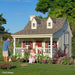 Children happily gardening outside the charming Pennfield Cottage Playhouse by Little Cottage Company.