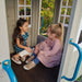 Kids playing inside the cozy playset