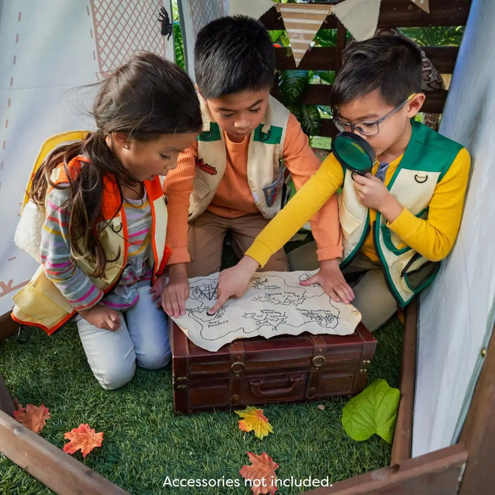 kids using a map under the outdoor Ranger Retreat Set