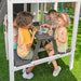 Kids enjoying their meal on the lower clubhouse of the playset