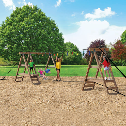 Children playing on Playstar Ninja Power Platform Gold obstacle course and swing set outdoors