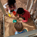Kids playing on the sand of seacove playset