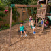 Kids swinging on the outdoor playset for kids