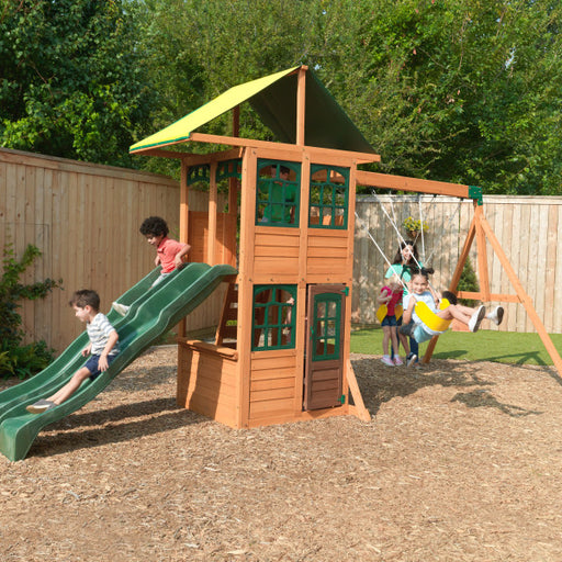 Kids on the playground playing on the cove wooden playset