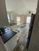 View of the kitchen under construction in the Champion Home No Loft, showcasing cabinetry and appliances.