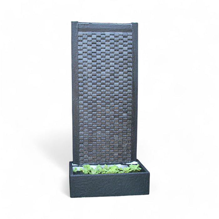 Laguna Wall Fountain with a vertical textured wall, water cascading down, and a stone-filled base with greenery accents, adding an elegant touch to any garden or patio.