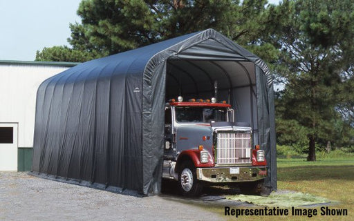 Large semi truck parked inside a gray ShelterLogic peak style fabric garage