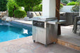 Outdoor setup showcasing the Wildfire 30-inch griddle cart positioned by a pool, featuring a sleek stainless steel body, side shelves, and a modern design perfect for patio cooking.