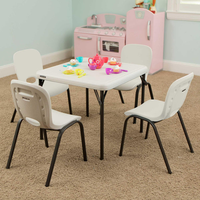 Lifetime 13 Pack Children's Stack Chair set around kids activity table with four chairs and play tea set in classroom setting