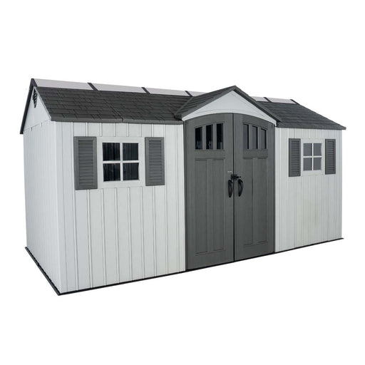 Front view of the Lifetime 15 x 8 Outdoor Storage Shed showing double doors, windows, and a pitched roof. The shed is designed for durability and style.