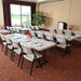 Classroom setup using Lifetime 18 Pack Professional Folding Table 6 ft with folding chairs and meeting materials
