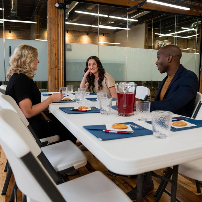 Lifetime 4 Pack 8-Foot Rectangle Folding Table used for office meeting with chairs, drinks, and snacks