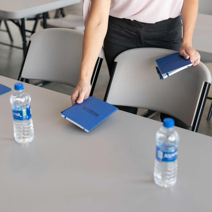 Lifetime 4 Pack Professional Folding Table in putty color used for meeting setup with chairs and water bottles