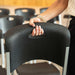 Close up of Lifetime 4 Pack Stacking Chair showing built in carry handle and textured black backrest.
