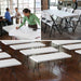 White Lifetime 6-foot folding table used in office and event spaces, lightweight design with sturdy steel legs and smooth surface