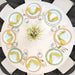 Top view of Lifetime 4 Pack 60 Inch Round Nesting Table set with place settings and full circle seating