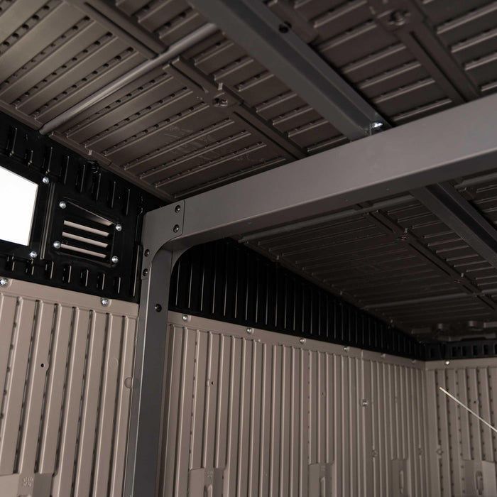 Interior ceiling view of the Lifetime Farmhouse Shed 60542 showing steel-reinforced roof beams, screened vent panel, and structured wall panel corner junction