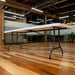 Side angle view of Lifetime 4 Pack 8-Foot Rectangle Folding Table with white top and gray steel folding legs