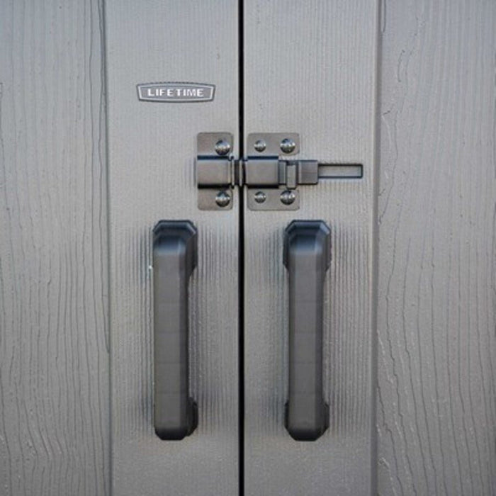 Close-up of the Lifetime-branded door handles and slider latch on the Modern Shed.