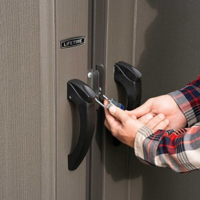 Close-up of a padlock securing the Lifetime-branded storage shed's lockable door handles.