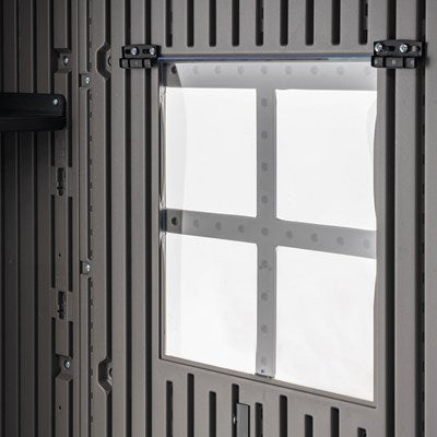 Close-up of a window on the Lifetime 20x8 outdoor storage shed, showing the shatterproof, translucent window pane and sturdy frame.
